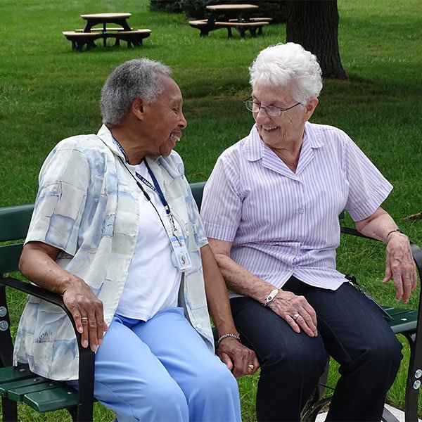 Sisters together on a bench